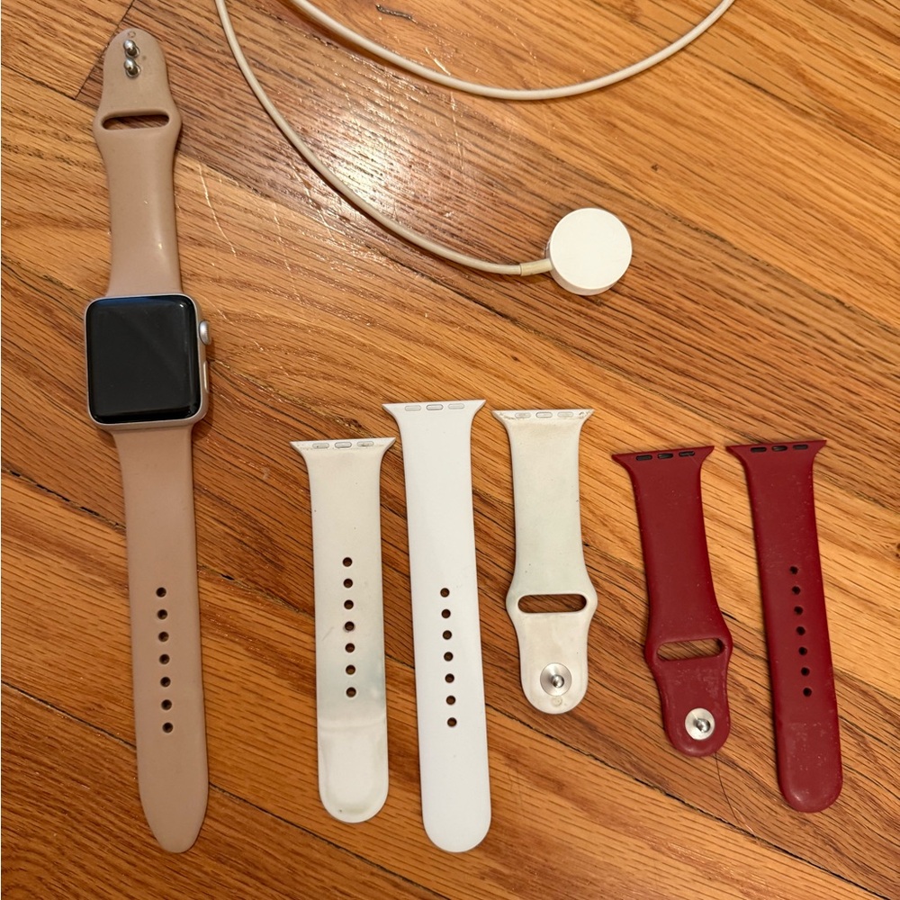 Apple Watch Series 3 (42 MM) with Tan, White, and Red Bands plus charger